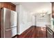 Eat-in kitchen with stainless steel refrigerator and wood floors at 504 Baltimore Sw Ave, Lilburn, GA 30047
