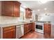 Kitchen with stainless steel dishwasher and oven, beautiful granite countertops and wood cabinets at 504 Baltimore Sw Ave, Lilburn, GA 30047