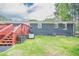 The backyard features a well-maintained lawn and a brick wall at 846 Orris Ln, Mableton, GA 30126