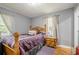 Bedroom featuring wooden floors, wooden furnishings, and a comfortable bed at 846 Orris Ln, Mableton, GA 30126