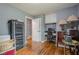 Bedroom with a built-in desk, hardwood floors, and a window with green curtains at 846 Orris Ln, Mableton, GA 30126