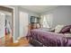Bedroom featuring wooden floors, a comfortable bed, and built-in storage at 846 Orris Ln, Mableton, GA 30126