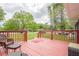 Relax on this outdoor deck, featuring a lush lawn and comfortable seating at 846 Orris Ln, Mableton, GA 30126