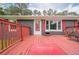 Inviting front deck with red railings and a cozy outdoor seating area at 846 Orris Ln, Mableton, GA 30126