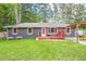 Charming one-story home with a spacious front yard, red shutters, and a cozy front deck at 846 Orris Ln, Mableton, GA 30126