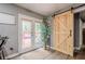Interior view of the home with a sliding barn door and access to the outdoor deck at 846 Orris Ln, Mableton, GA 30126