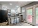Eat-in kitchen featuring stainless appliances, gray cabinets, and a breakfast bar looking out to a deck at 846 Orris Ln, Mableton, GA 30126