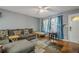 Cozy living room with ample seating, hardwood floors, and natural light at 846 Orris Ln, Mableton, GA 30126