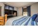 Cozy main bedroom featuring soothing blue decor, complemented by a large flatscreen TV for relaxation at 846 Orris Ln, Mableton, GA 30126