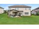 Large backyard area with a covered patio, ideal for outdoor living and entertainment at 2511 Day Break Way, Dacula, GA 30019