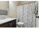 Cozy bathroom featuring a shower curtain, decorative mirror and sink at 2511 Day Break Way, Dacula, GA 30019