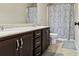Well-lit bathroom features double vanity, shower, and a separate toilet at 2511 Day Break Way, Dacula, GA 30019
