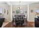 Cozy eat-in kitchen area with hardwood floors and natural light with seating for four at 2511 Day Break Way, Dacula, GA 30019