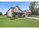 Charming two-story home with well-maintained landscaping, lush lawn, and a two-car garage at 2511 Day Break Way, Dacula, GA 30019