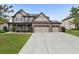 Beautiful two-story brick home with a manicured lawn and a large driveway at 2511 Day Break Way, Dacula, GA 30019