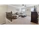 Cozy living room features neutral walls, carpeted floors, and comfortable furniture at 2511 Day Break Way, Dacula, GA 30019