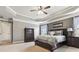 Spacious main bedroom with carpet, coffered ceiling, and traditional-style furniture at 2511 Day Break Way, Dacula, GA 30019
