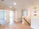 Upper hallway with hardwood floors leading to bedrooms, with stylish light fixture at 2626 Radvell Ct, Decatur, GA 30034