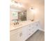 Modern bathroom boasts a double vanity, quartz counters, and walk-in shower at 2626 Radvell Ct, Decatur, GA 30034