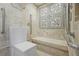 Handicap accessible bathroom features decorative tile work in the shower and safety grab bars at 2637 Peachtree Ne Rd # 407, Atlanta, GA 30305