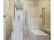 Accessible bathroom featuring a modern, free-standing sink, wall-mounted toilet, and grab bars at 2637 Peachtree Ne Rd # 407, Atlanta, GA 30305