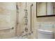 Tiled bathroom with accessible tub/shower and multiple shower heads at 2637 Peachtree Ne Rd # 407, Atlanta, GA 30305