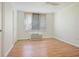 Bedroom with wood floors, neutral walls, and window with blinds at 2637 Peachtree Ne Rd # 407, Atlanta, GA 30305