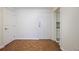 Condo entryway featuring hardwood floors and white trim, with a view of the kitchen at 2637 Peachtree Ne Rd # 407, Atlanta, GA 30305