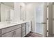 Modern bathroom features double vanity with white countertops and gray cabinets at 2762 Aralynn Way, College Park, GA 30337