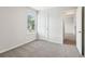 Light-filled bedroom featuring gray carpeting and a window offering natural light at 2762 Aralynn Way, College Park, GA 30337