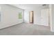 Bright bedroom with neutral carpet, crisp white walls, window, and a door at 2762 Aralynn Way, College Park, GA 30337