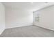 Bright bedroom with neutral carpet, crisp white walls, and a window at 2762 Aralynn Way, College Park, GA 30337