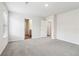 Spacious bedroom with neutral carpet, crisp white walls, window, and 2 doors at 2762 Aralynn Way, College Park, GA 30337
