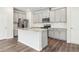 Open kitchen with stainless steel appliances, granite countertops, and ample cabinetry at 2762 Aralynn Way, College Park, GA 30337