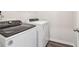 Convenient laundry room with modern appliances and durable flooring for easy maintenance at 2762 Aralynn Way, College Park, GA 30337