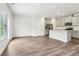 Open-concept living area flowing into a modern kitchen with stainless steel appliances at 2762 Aralynn Way, College Park, GA 30337