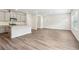 Open-concept living area with a kitchen featuring an island and modern appliances at 2762 Aralynn Way, College Park, GA 30337
