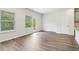 Open living space with hardwood floors, large windows, and access to the outdoors at 2762 Aralynn Way, College Park, GA 30337