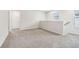 Bright, open loft area with neutral carpeting and views of the staircase at 2762 Aralynn Way, College Park, GA 30337