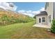 A spacious backyard and patio area with a slight hill and landscaping along the City College area at 2764 Aralynn Way, College Park, GA 30337