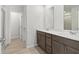 Bathroom with double sink vanity, wood-look flooring, and a separate shower room at 2764 Aralynn Way, College Park, GA 30337