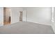 Spacious bedroom with light gray carpet and access to a bathroom with double sinks at 2764 Aralynn Way, College Park, GA 30337