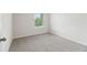 Light and bright bedroom with gray carpet and neutral walls at 2764 Aralynn Way, College Park, GA 30337