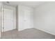 This bedroom offers neutral tones, plush carpet, and closet space at 2764 Aralynn Way, College Park, GA 30337