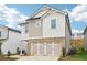 Picture of a two-story home with brick accents and an attached two-car garage at 2764 Aralynn Way, College Park, GA 30337