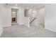 Bright hallway with gray carpet, with bathroom visible in the background at 2764 Aralynn Way, College Park, GA 30337
