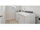 Bright laundry room with modern washer and dryer units at 2764 Aralynn Way, College Park, GA 30337