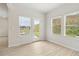 Room with ample windows and a door to the yard bringing in lots of light at 2764 Aralynn Way, College Park, GA 30337