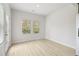 Sunny room with light wood floors and large windows providing natural light and outside view at 2764 Aralynn Way, College Park, GA 30337