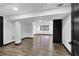 Finished basement with wood-look flooring and recessed lighting; ready for customization and ample space at 3661 W Potomac Dr, East Point, GA 30344
